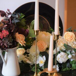 Set of 10 gold tone candle holders and brand new taper candles